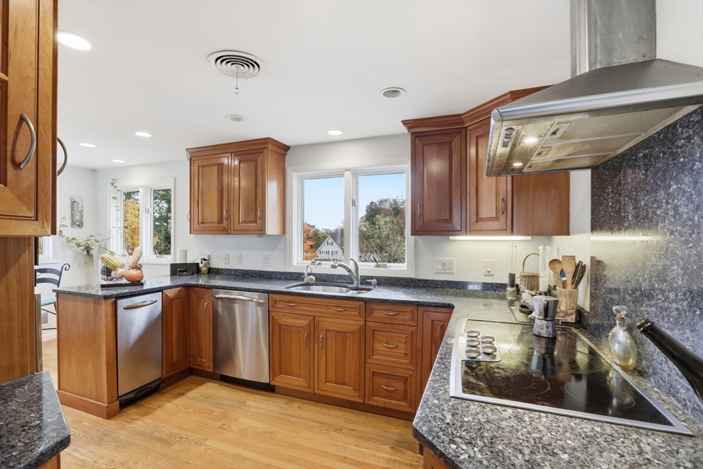 22 Burdett Road Lynn, MA 01904 - Photo 8 of 30 a kitchen with a sink a stove and cabinets
