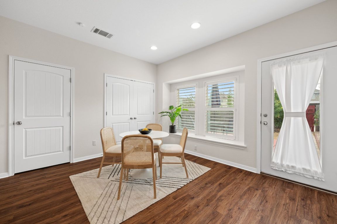 4517 Truth Way, Unit 412 Austin, TX 78725 - Photo 14 of 25 a living room with furniture and wooden floor
