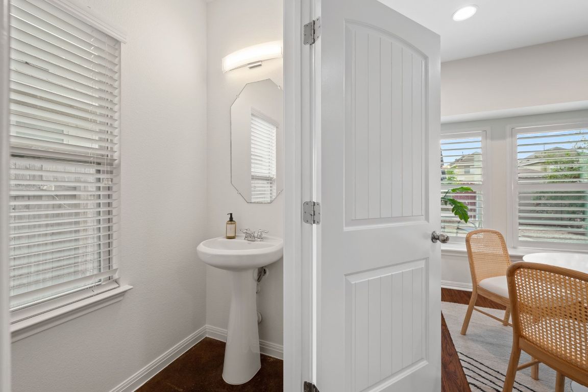 4517 Truth Way, Unit 412 Austin, TX 78725 - Photo 16 of 25 a bathroom with a sink and mirror