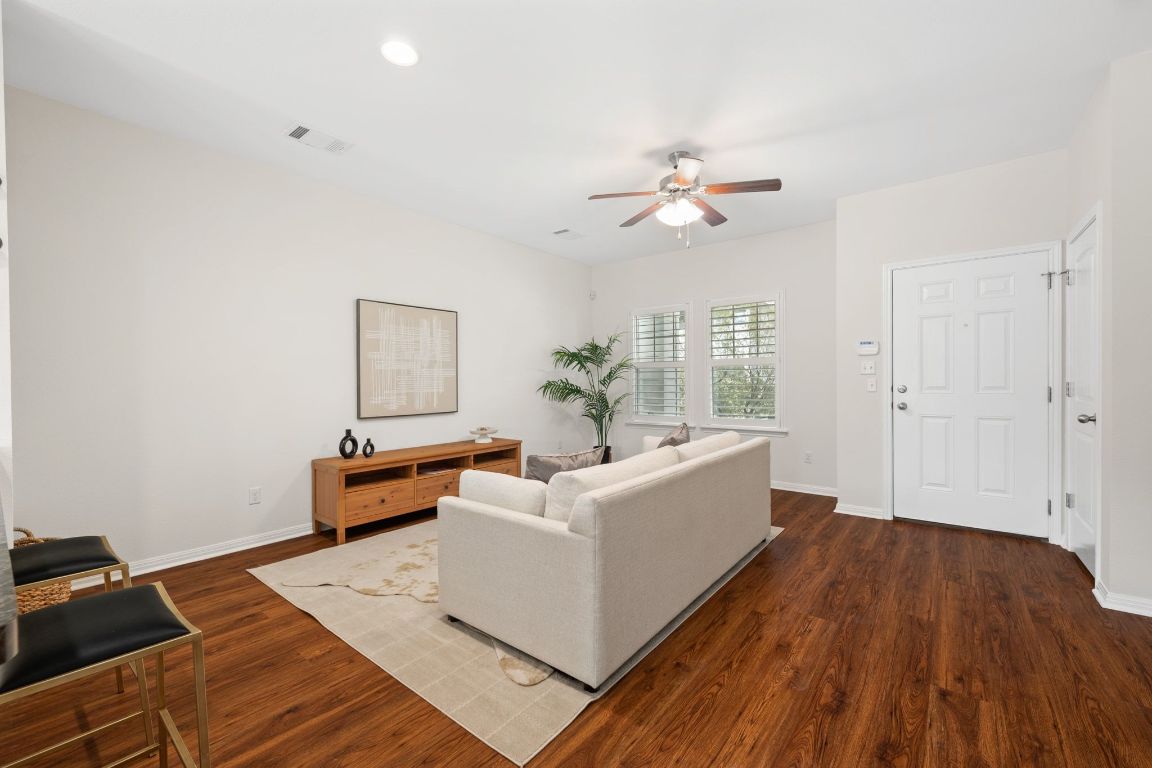 4517 Truth Way, Unit 412 Austin, TX 78725 - Photo 10 of 25 a living room with furniture and wooden floor