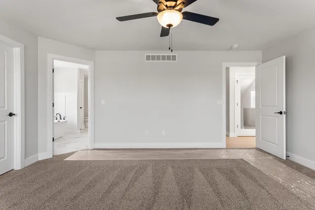 a bathroom with a granite countertop sink mirror and a shower