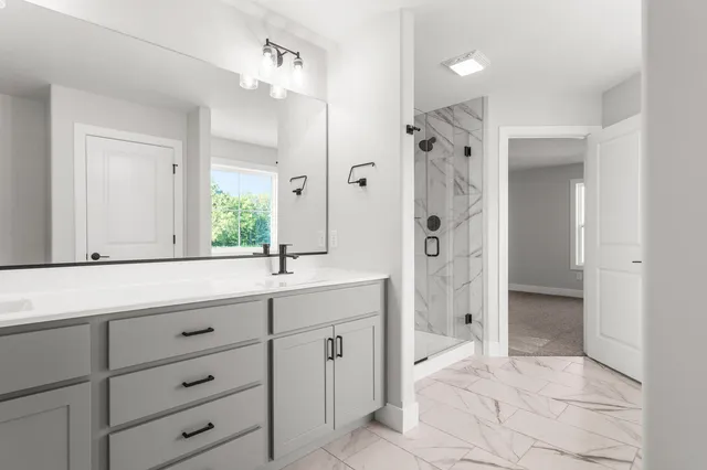 a white bath tub sitting next to a toilet