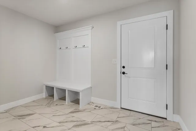 a bathroom with a sink toilet and a mirror
