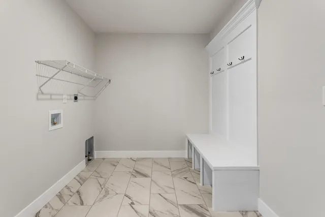 a view of a hallway with stairs