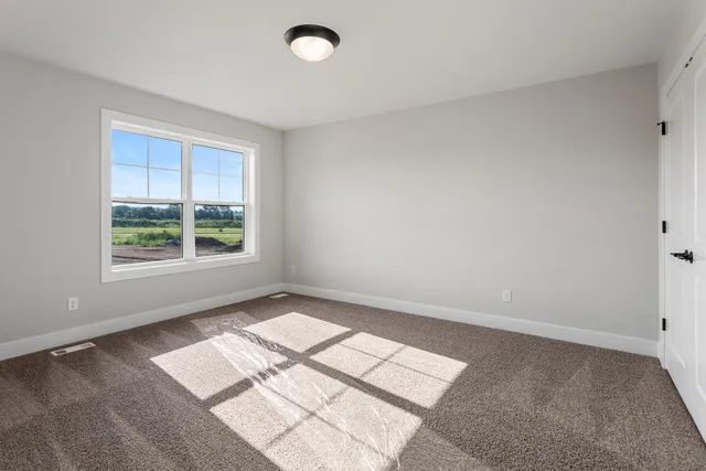 a view of a bedroom with window