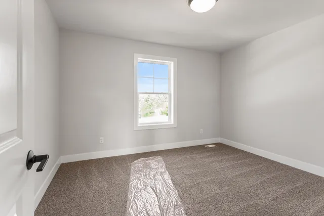 a bathroom with a double vanity sink a mirror and a bathtub