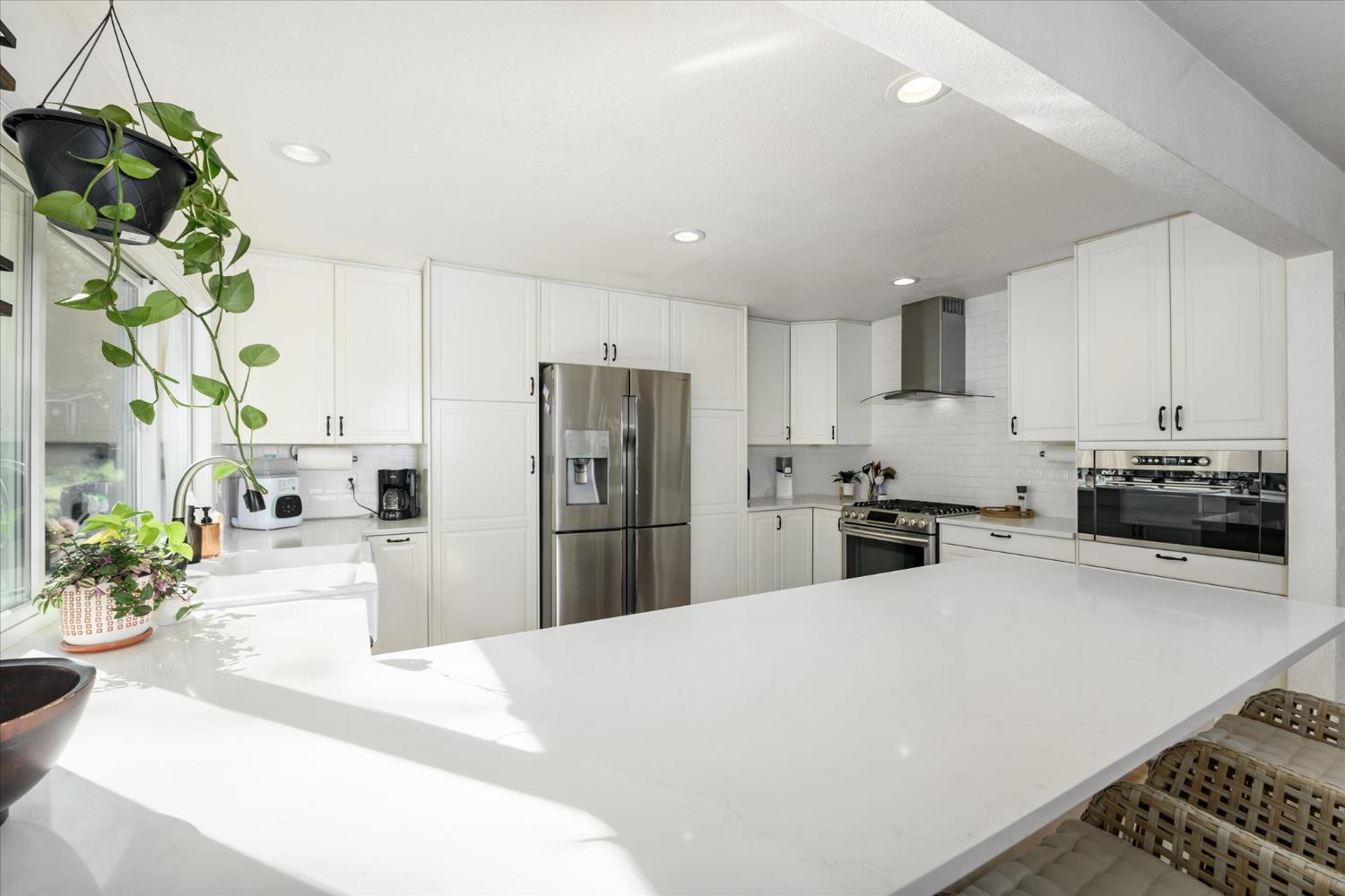 3640 Omo Ranch Road Somerset, CA 95684 - Photo 15 of 57 a kitchen with refrigerator and a white table