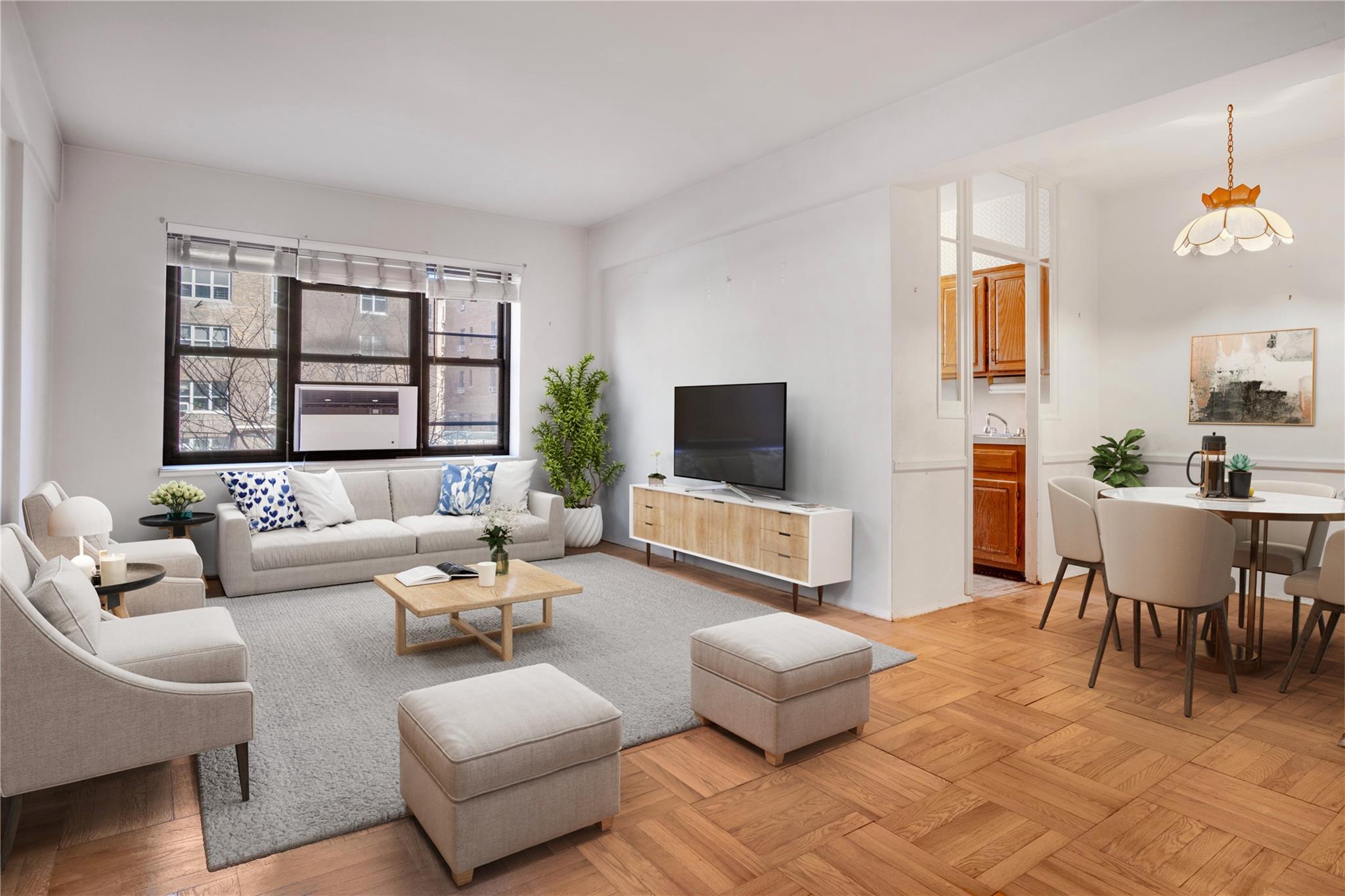 a living room with furniture and a flat screen tv