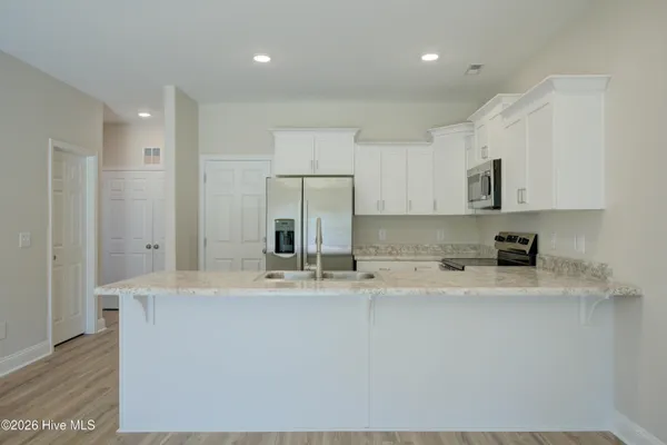 $304,900 | 215 Sandpiper Place, Sneads Ferry, NC 28460