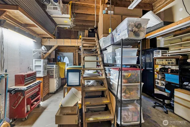 a kitchen with stainless steel appliances kitchen island granite countertop a refrigerator and cabinets
