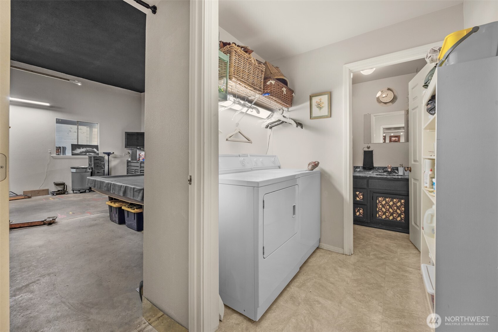 525 192nd Place Southeast Bothell, WA 98012 - Photo 19 of 22 a kitchen with stainless steel appliances kitchen island granite countertop a refrigerator and cabinets