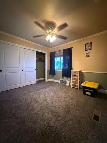 a bedroom with furniture and a chandelier