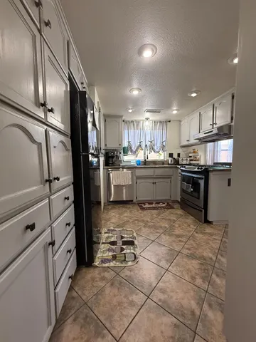 a view of a livingroom with furniture and windows