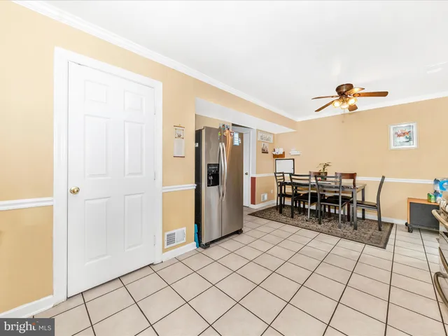 a kitchen with granite countertop a sink cabinets and stove top oven