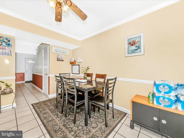 a view of a dining room with furniture and a window