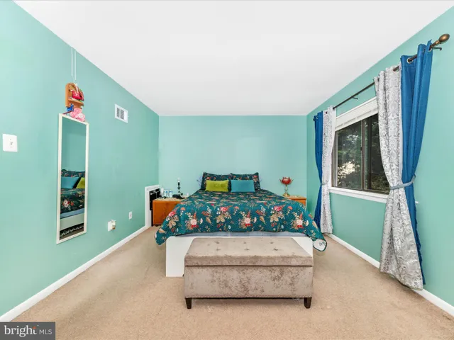 a bedroom with furniture and a bed