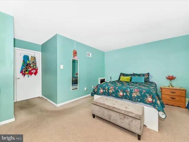 a bedroom with a bed and a cabinets