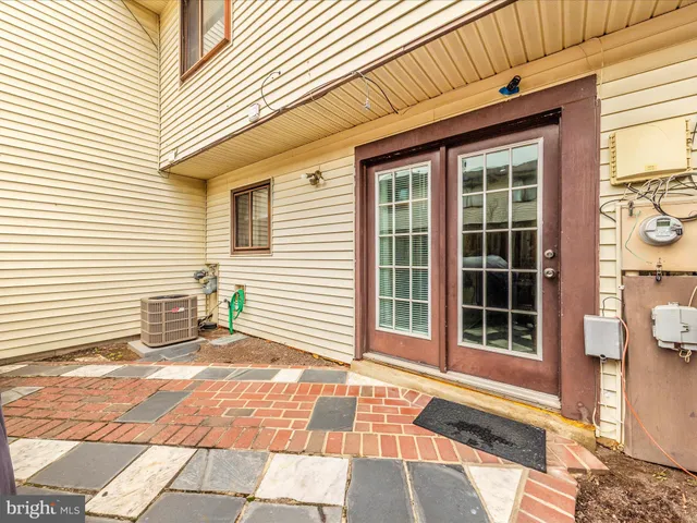 a view of a patio with a table and chairs