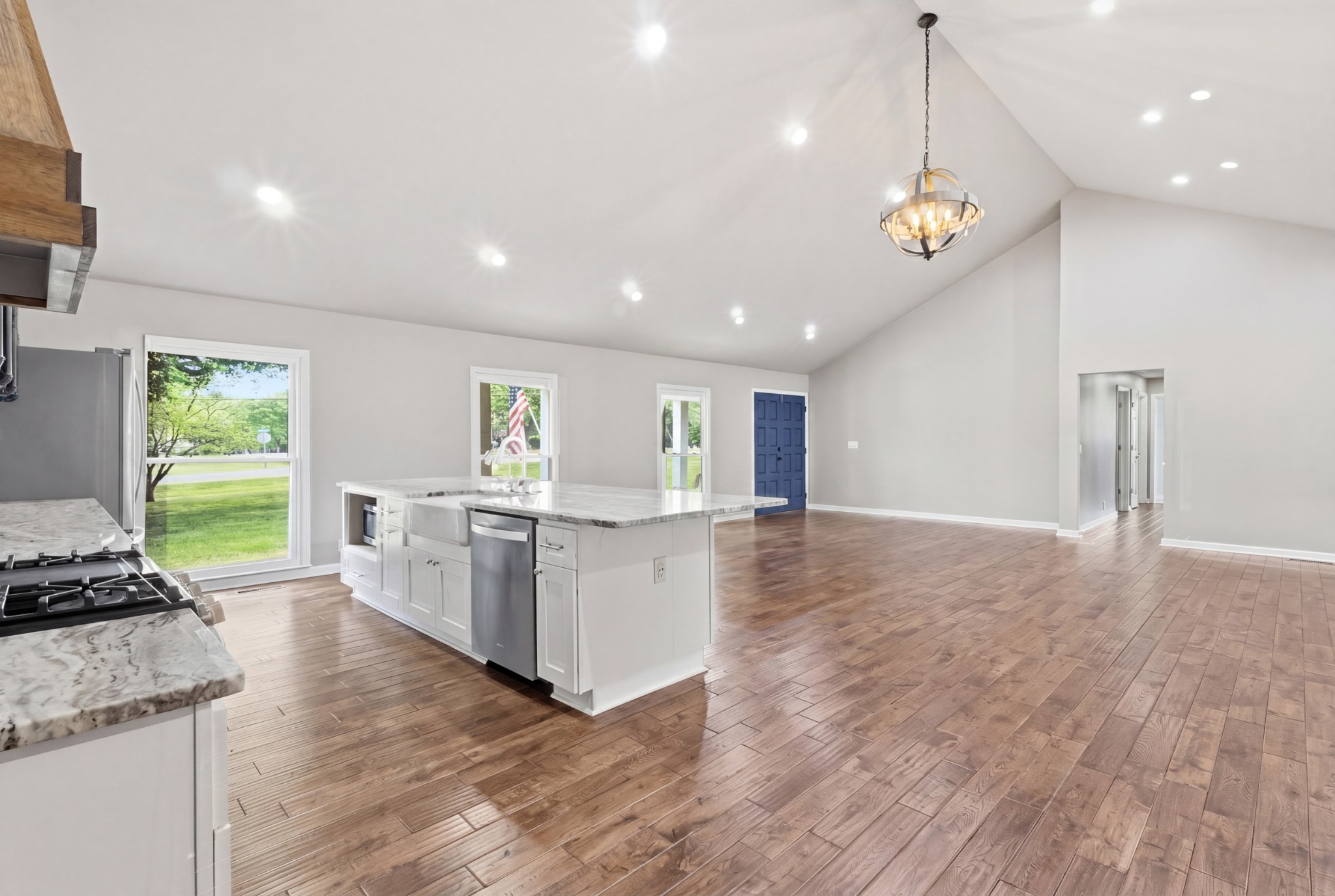 2228 Bowman Road Franklin, TN 37064 - Photo 13 of 44 a open kitchen with stainless steel appliances granite countertop a stove and a wooden floors