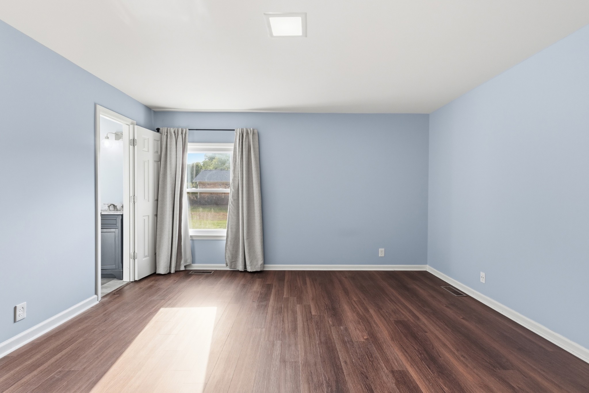 2228 Bowman Road Franklin, TN 37064 - Photo 18 of 44 an empty room with wooden floor and windows