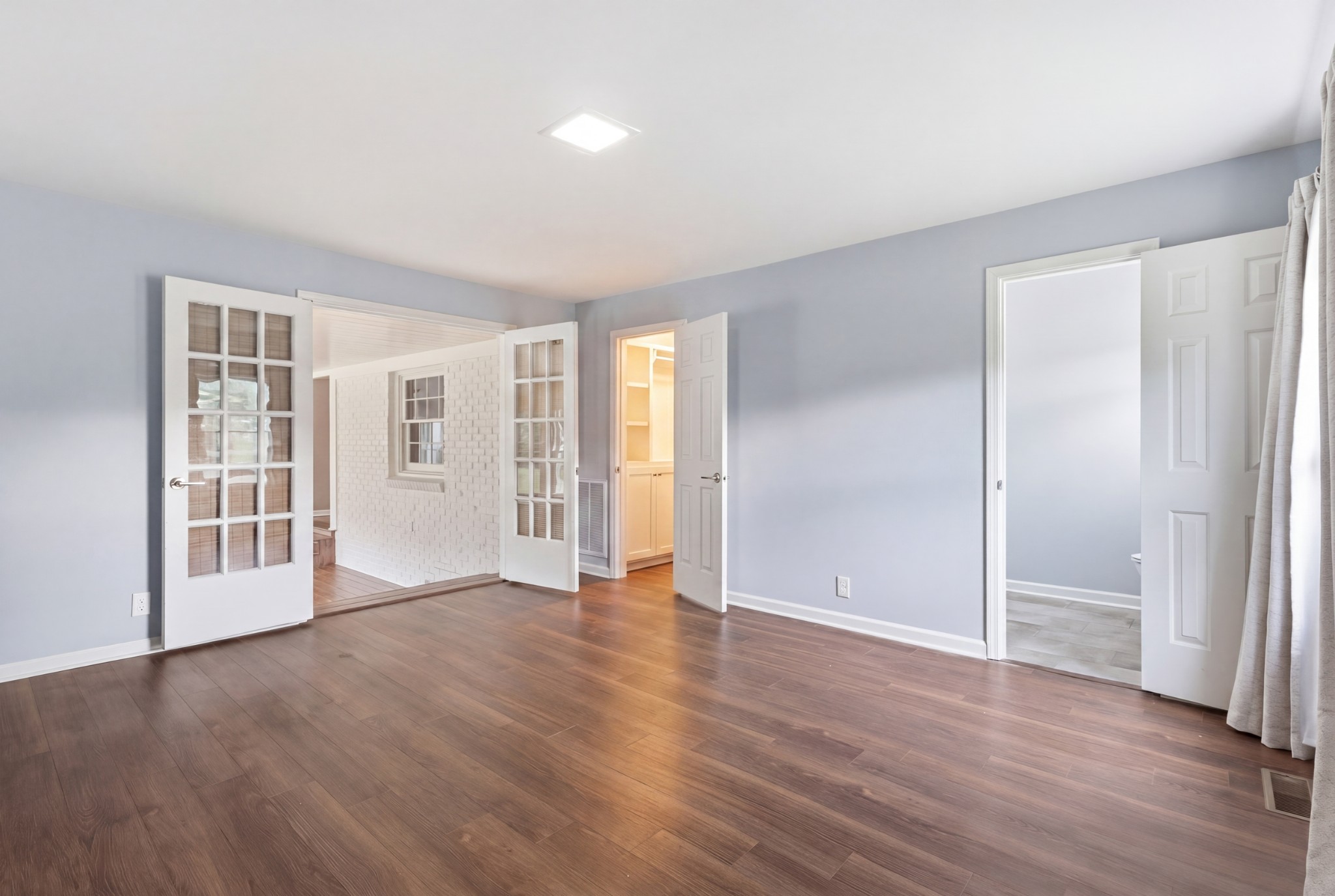 2228 Bowman Road Franklin, TN 37064 - Photo 19 of 44 an empty room with wooden floor and windows