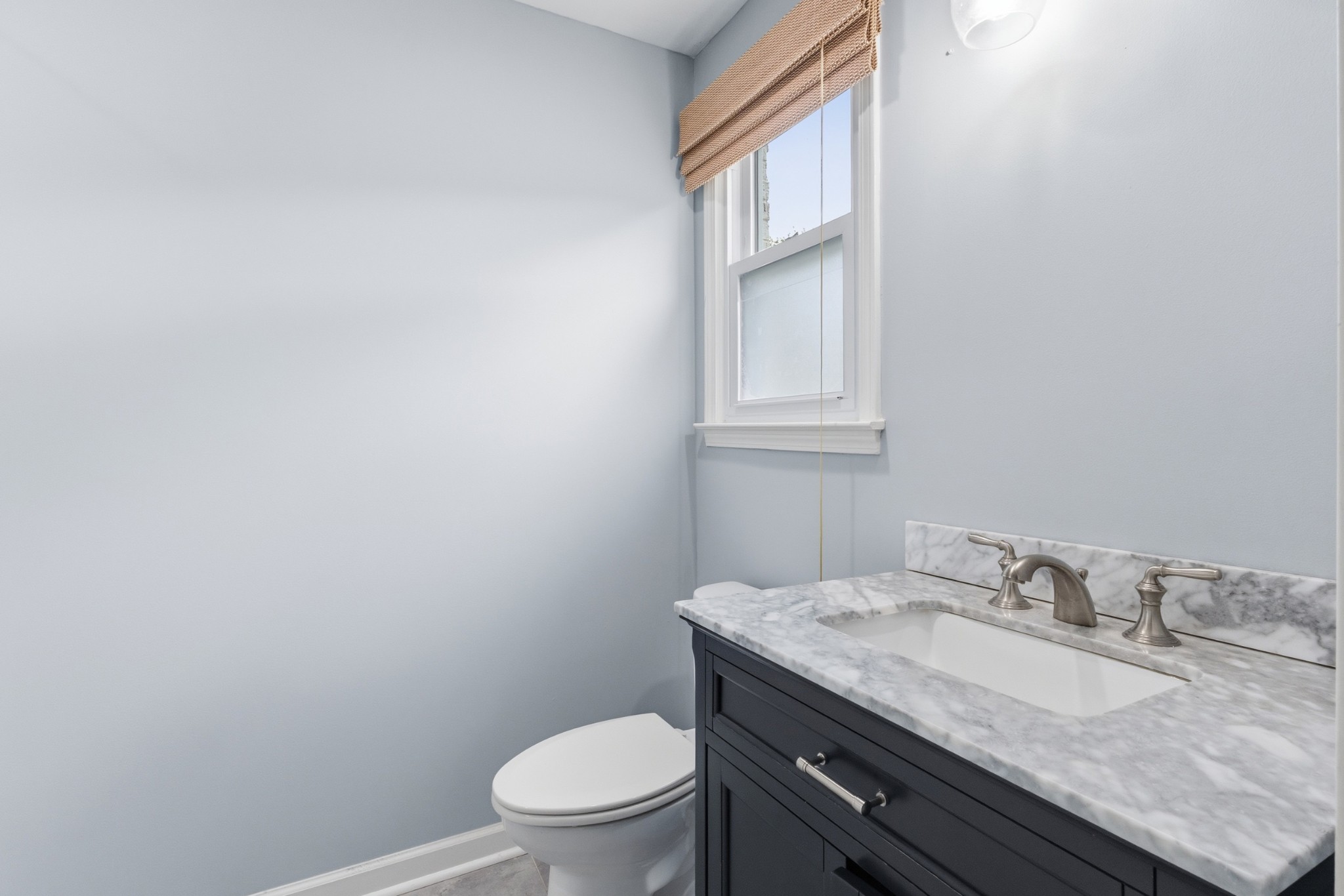 2228 Bowman Road Franklin, TN 37064 - Photo 22 of 44 a bathroom with a granite countertop sink toilet and mirror