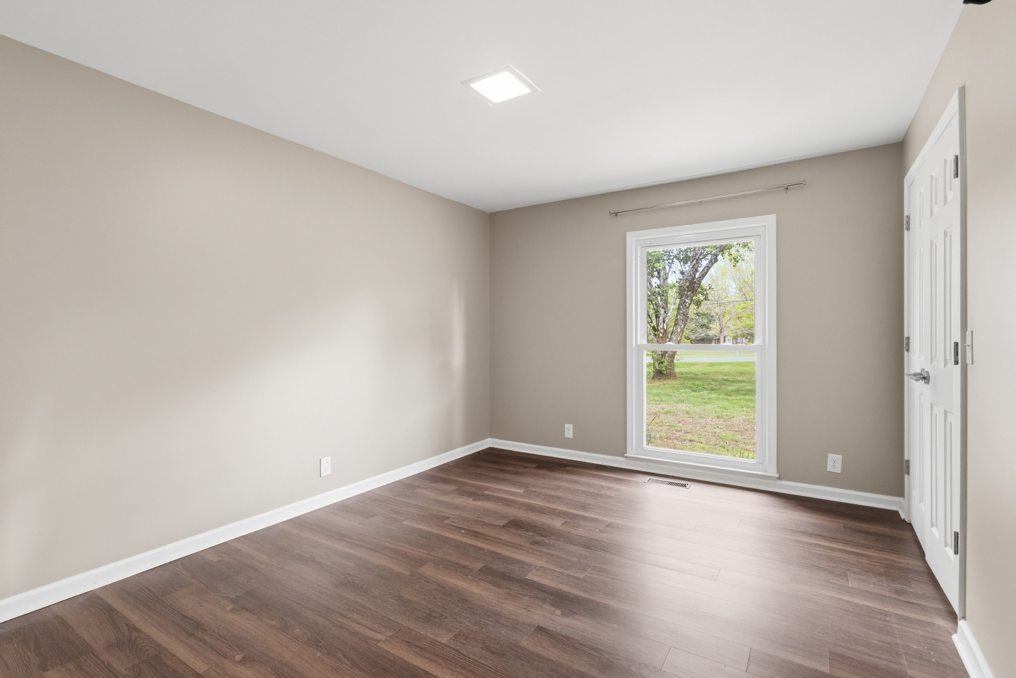 2228 Bowman Road Franklin, TN 37064 - Photo 23 of 44 an empty room with wooden floor and windows