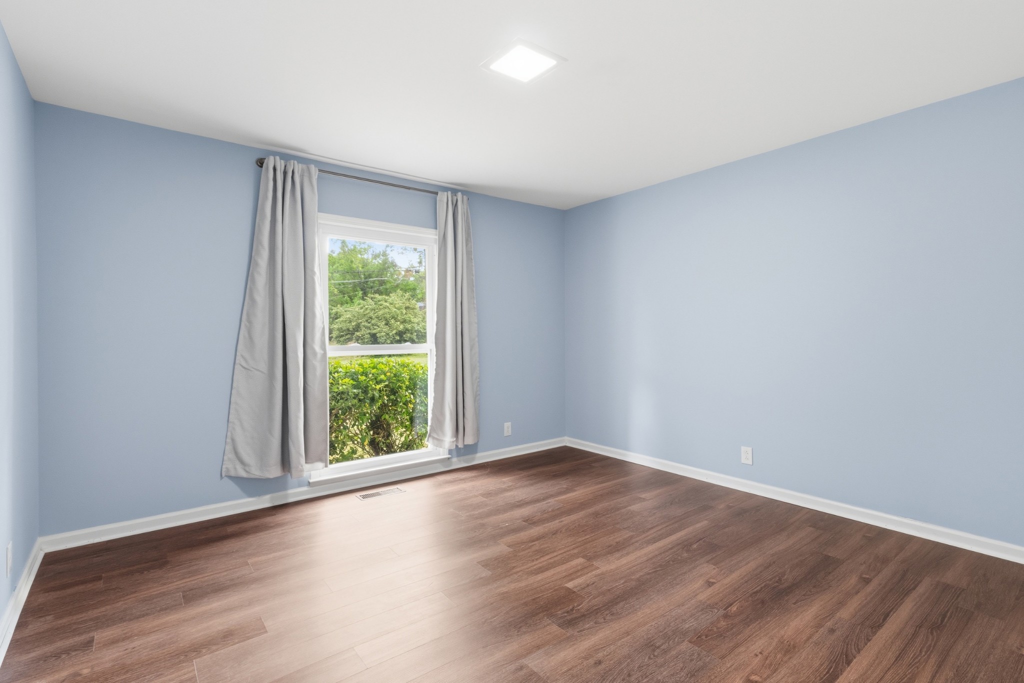 2228 Bowman Road Franklin, TN 37064 - Photo 27 of 44 a view of an empty room with wooden floor and window
