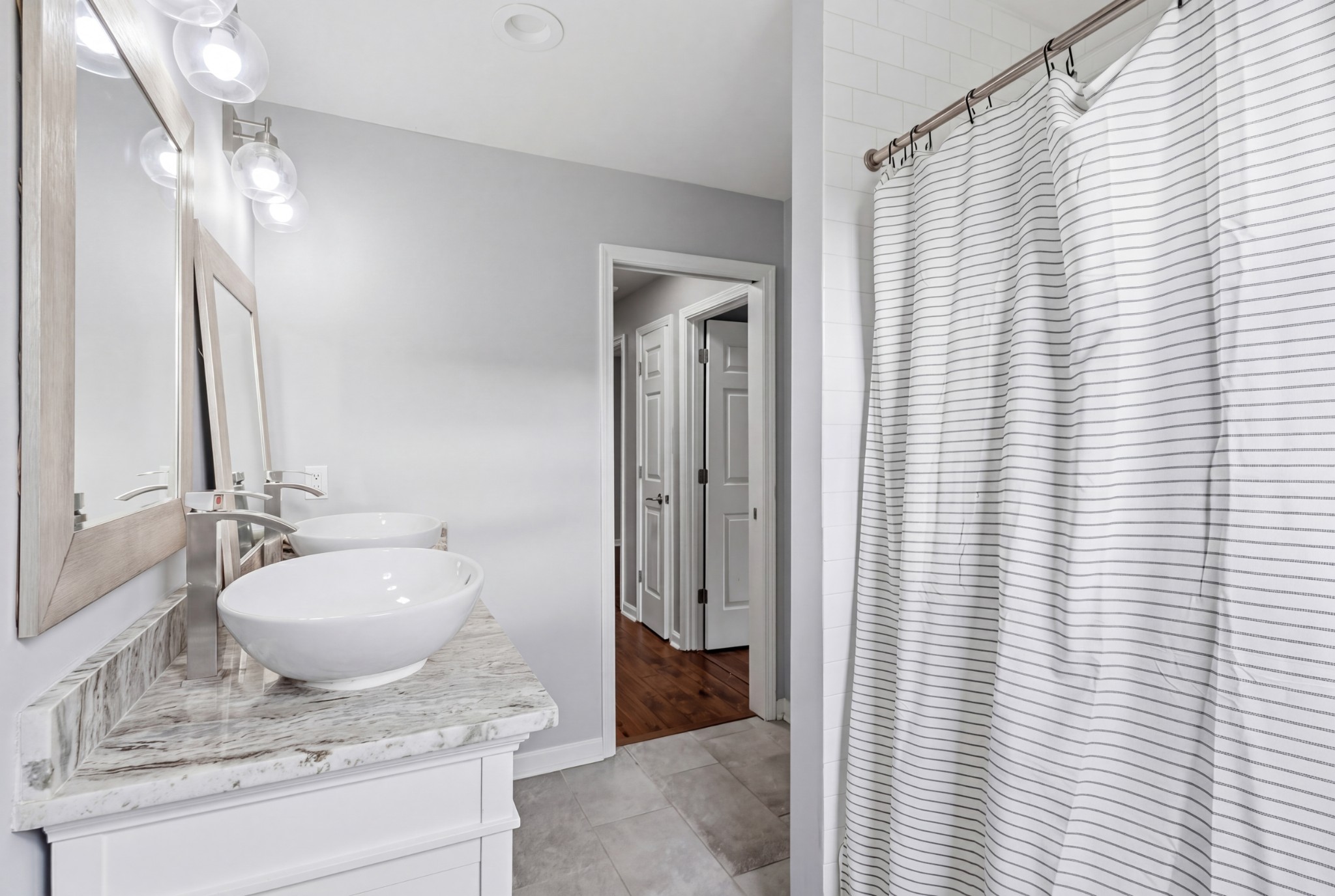 2228 Bowman Road Franklin, TN 37064 - Photo 30 of 44 a bathroom with a granite countertop sink and a mirror