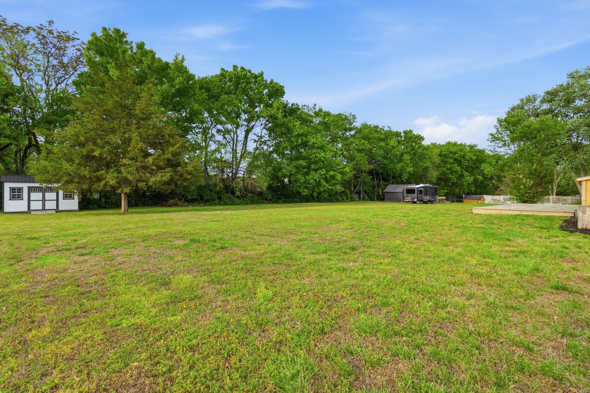 2228 Bowman Road Franklin, TN 37064 - Photo 39 of 44 a view of a green field with trees in the background