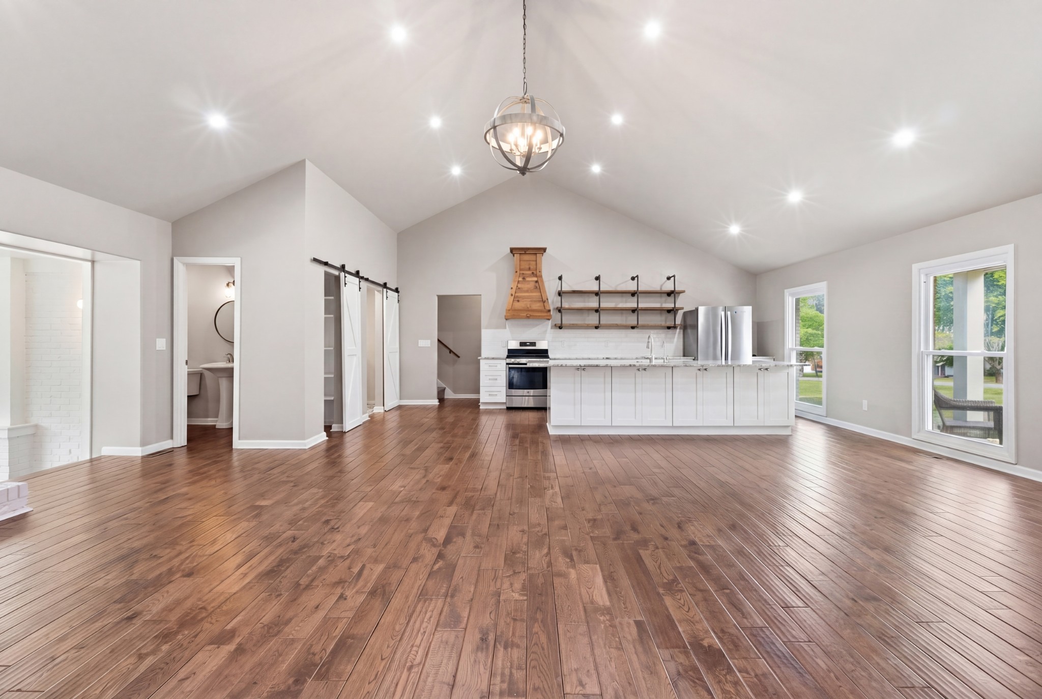 2228 Bowman Road Franklin, TN 37064 - Photo 7 of 44 a view of a kitchen with a stove cabinets and wooden floor