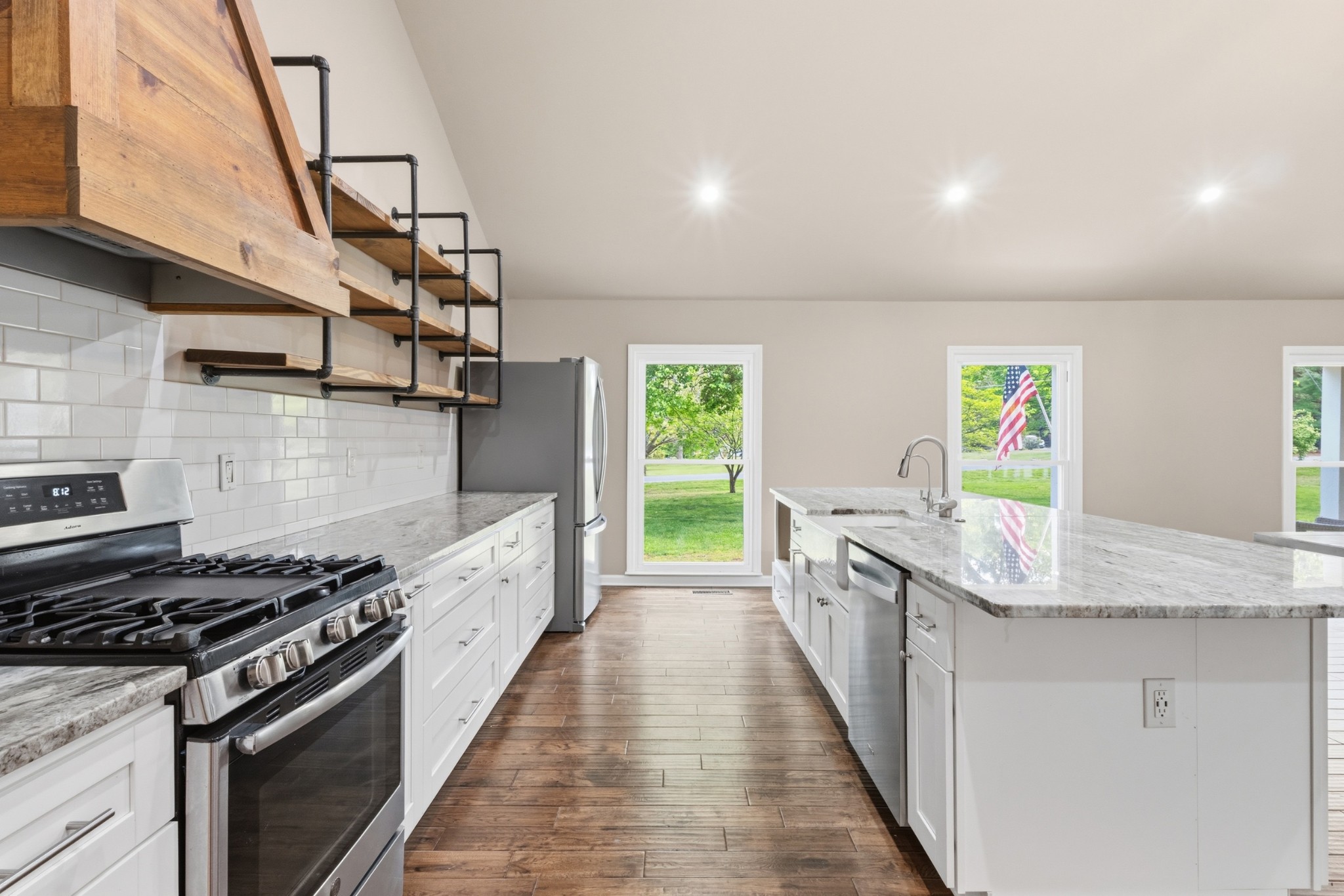 2228 Bowman Road Franklin, TN 37064 - Photo 10 of 44 a kitchen with stainless steel appliances granite countertop a stove and a sink