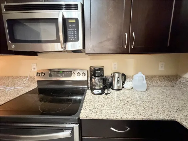 a kitchen with a stove and a microwave