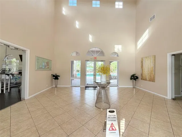 a lobby with furniture and wooden floor