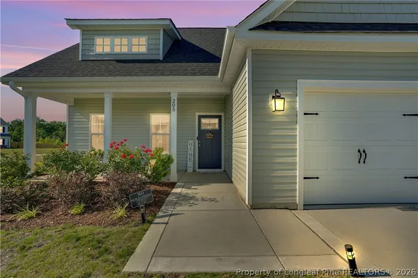 a view of a house with a small yard