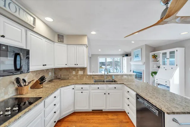 an aerial view of a houses with outdoor space and lake view
