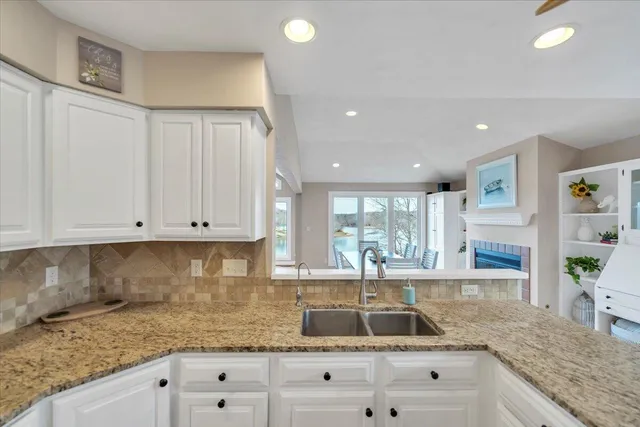 a view of a house with a large trees