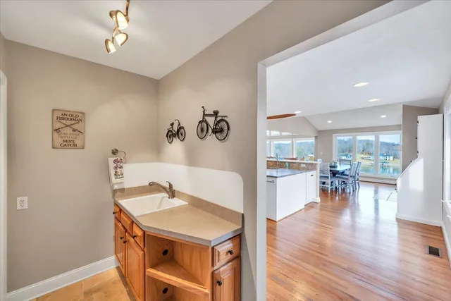 an aerial view of residential houses with outdoor space and swimming pool