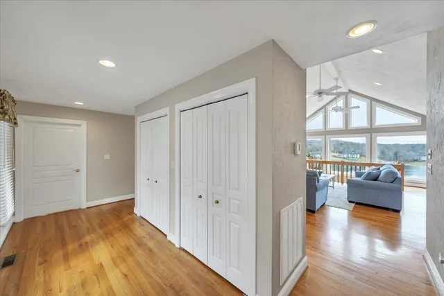 a dining room with furniture and wooden floor