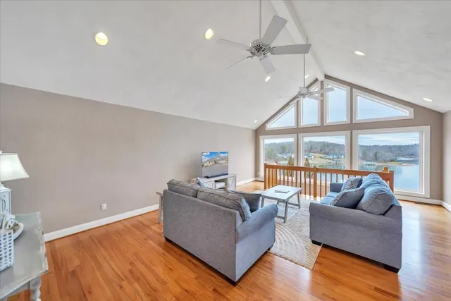 a bed room with a bed and a large window