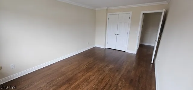an empty room with wooden floor