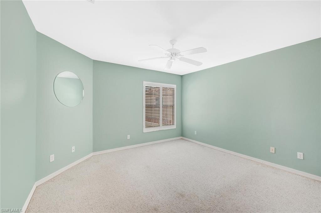 3520 Windjammer Circle, Unit 102 Naples, FL 34112 - Photo 13 of 26 a view of an empty room with a window