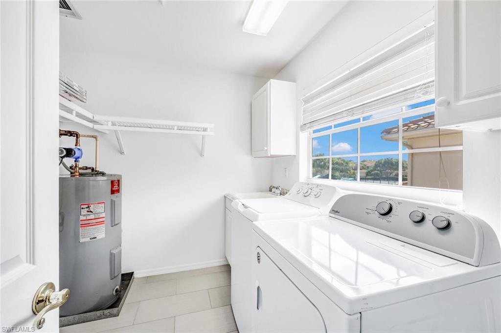 3520 Windjammer Circle, Unit 102 Naples, FL 34112 - Photo 17 of 26 a utility room with dryer and washer