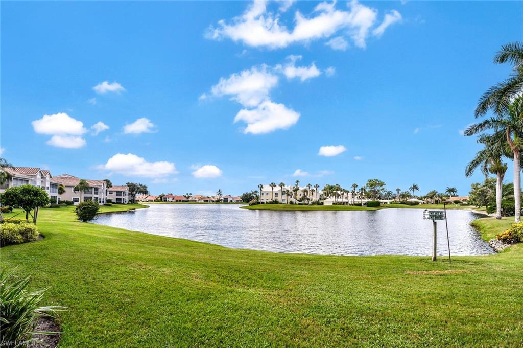 3520 Windjammer Circle, Unit 102 Naples, FL 34112 - Photo 2 of 26 a view of a lake with a city