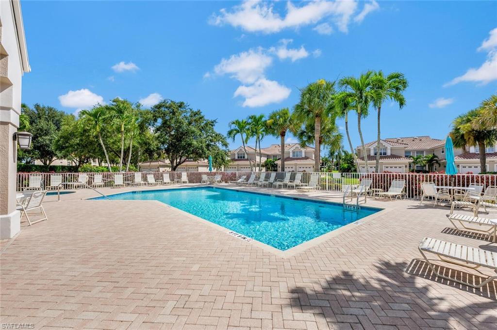 3520 Windjammer Circle, Unit 102 Naples, FL 34112 - Photo 21 of 26 a view of a swimming pool with a patio