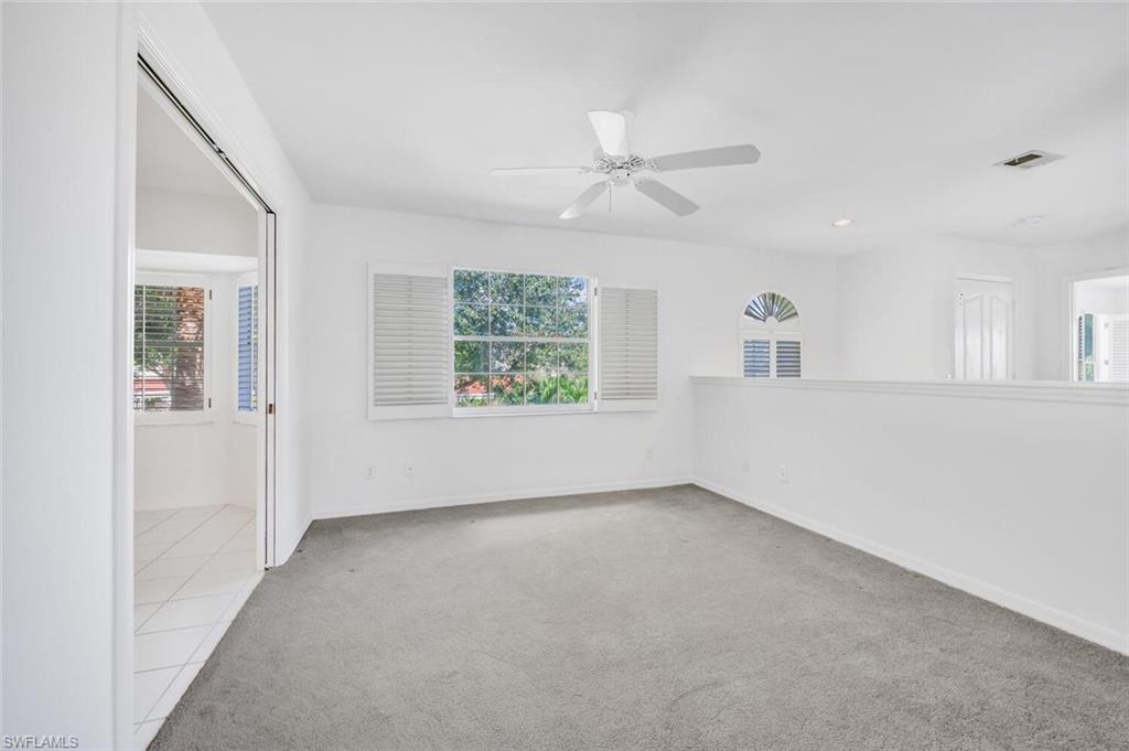3520 Windjammer Circle, Unit 102 Naples, FL 34112 - Photo 4 of 26 a view of an empty room with a window