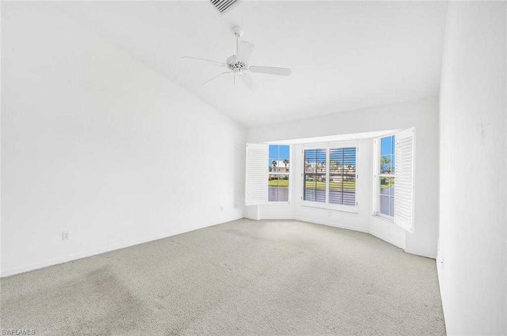 3520 Windjammer Circle, Unit 102 Naples, FL 34112 - Photo 10 of 26 an empty room with a empty space and windows