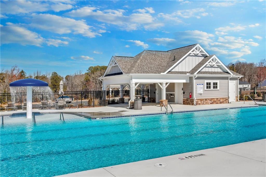 1647 Tide Ml Road Cumming, GA 30040 - Photo 20 of 21 a front view of a house with swimming pool having outdoor seating