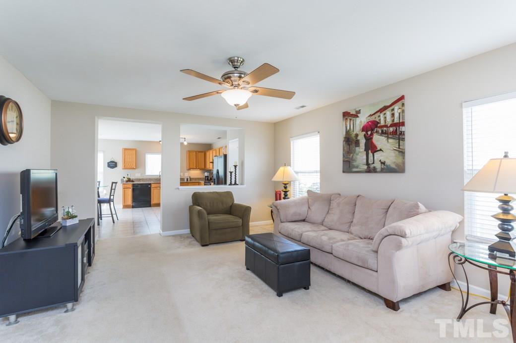 2629 Quarry Ridge Lane Raleigh, NC 27610 - Photo 2 of 12 a living room with furniture and a flat screen tv