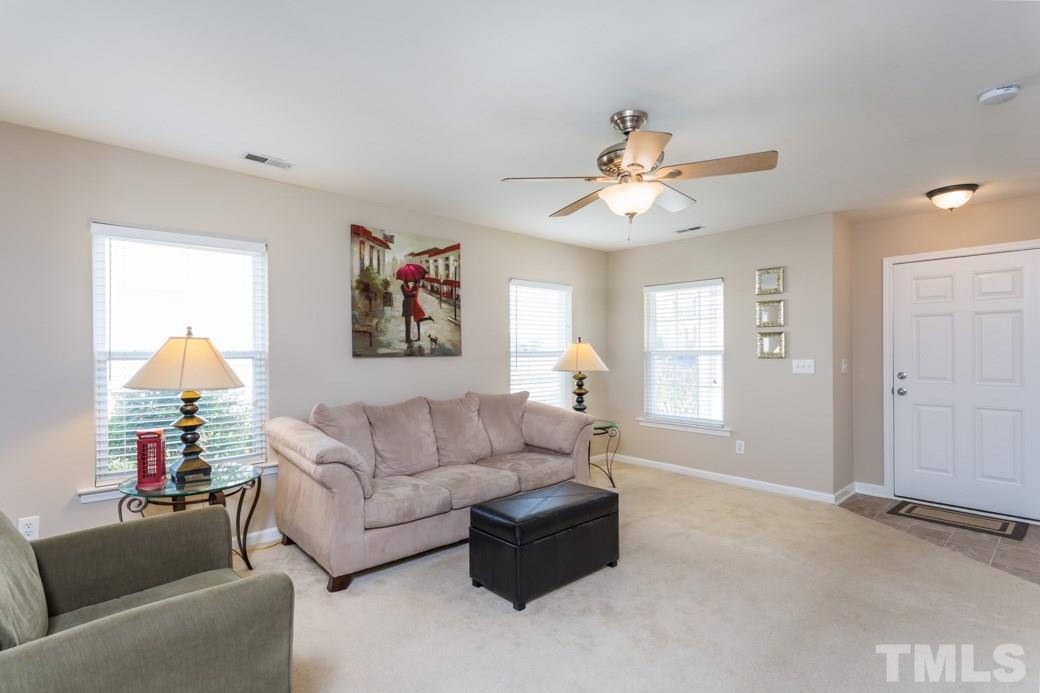 2629 Quarry Ridge Lane Raleigh, NC 27610 - Photo 3 of 12 a living room with furniture and a ceiling fan